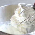 Keto whipped cream sugar-free on an electric mixer whisk.