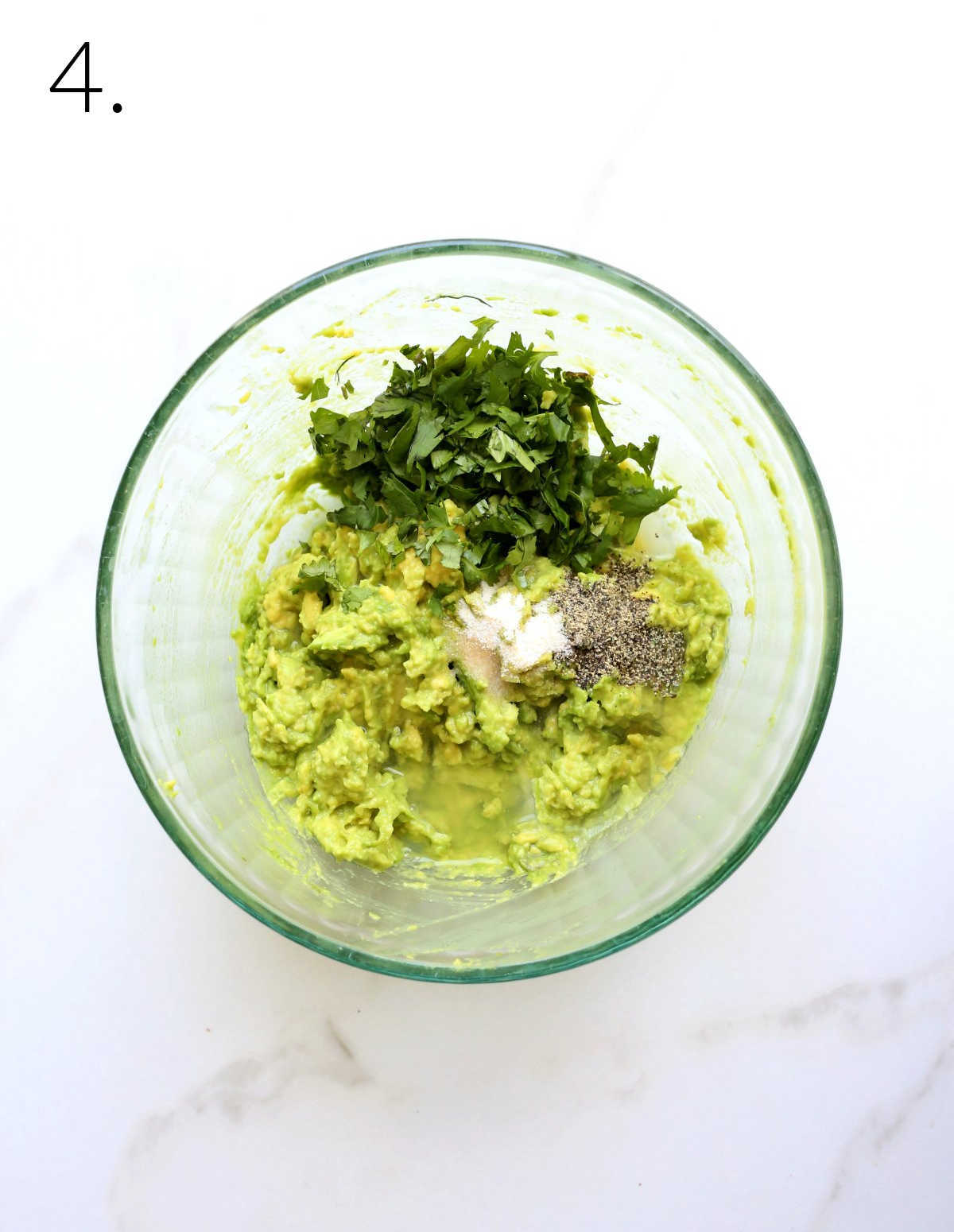 Mixing Bowl with Avocado, Cilantro, Lime Juice, Salt and Pepper.