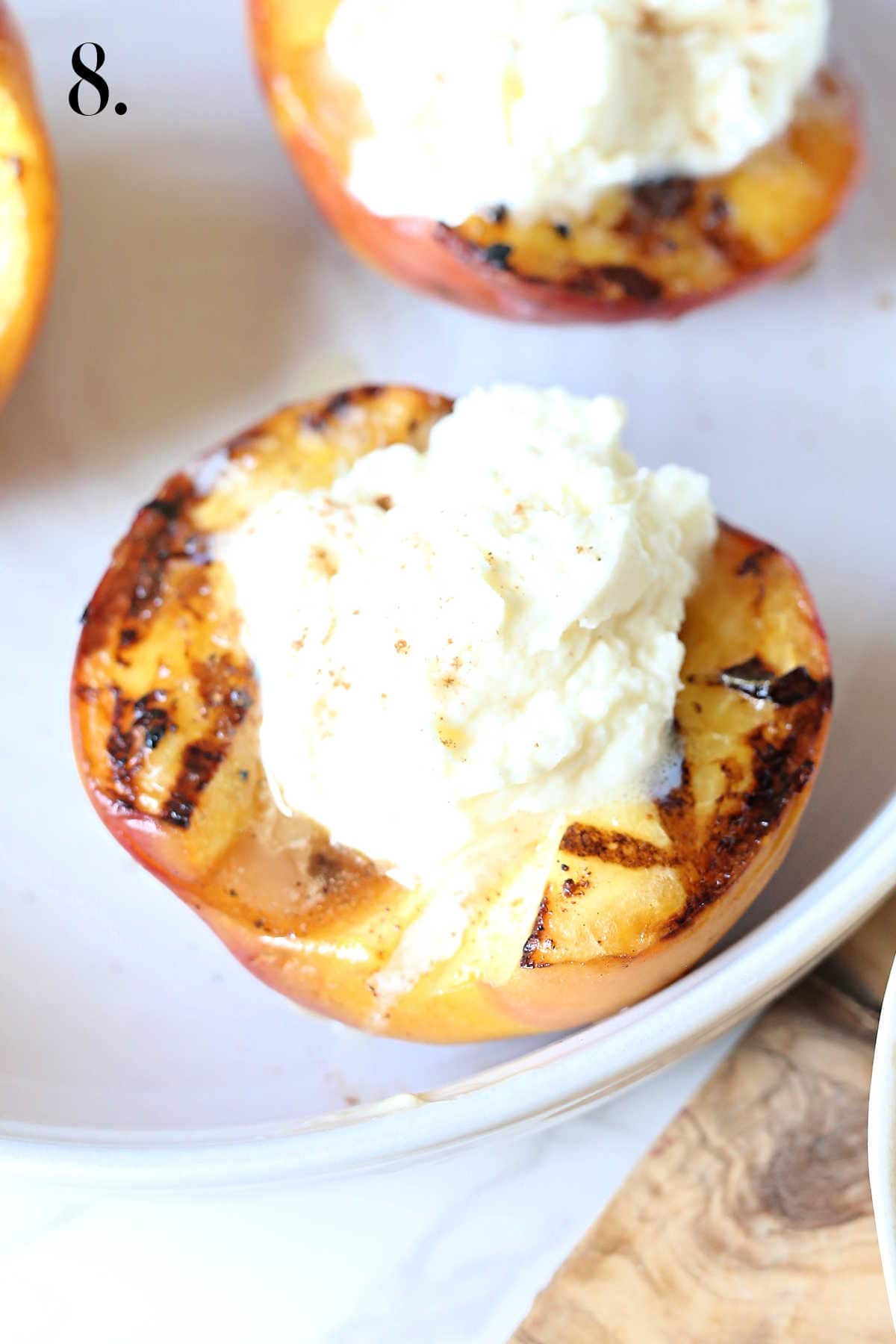 Stuffed peaches with whipped cream.