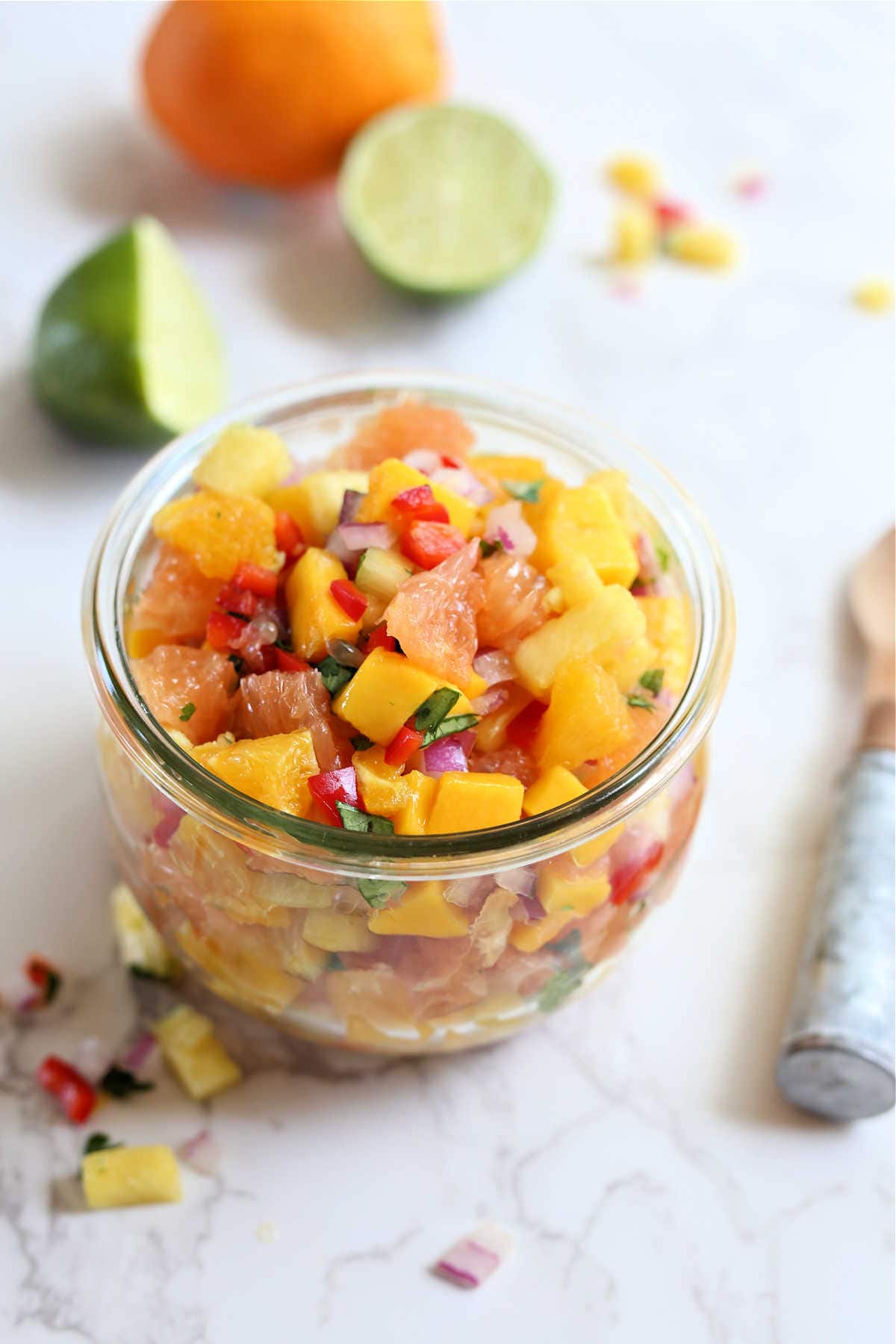 Fresh and tasty diced fruit in a bowl for fruit salsa made with citrus fruit.
