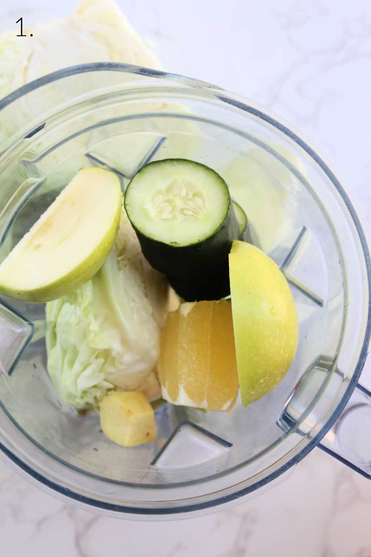 Cabbage juice ingredients in a blender.