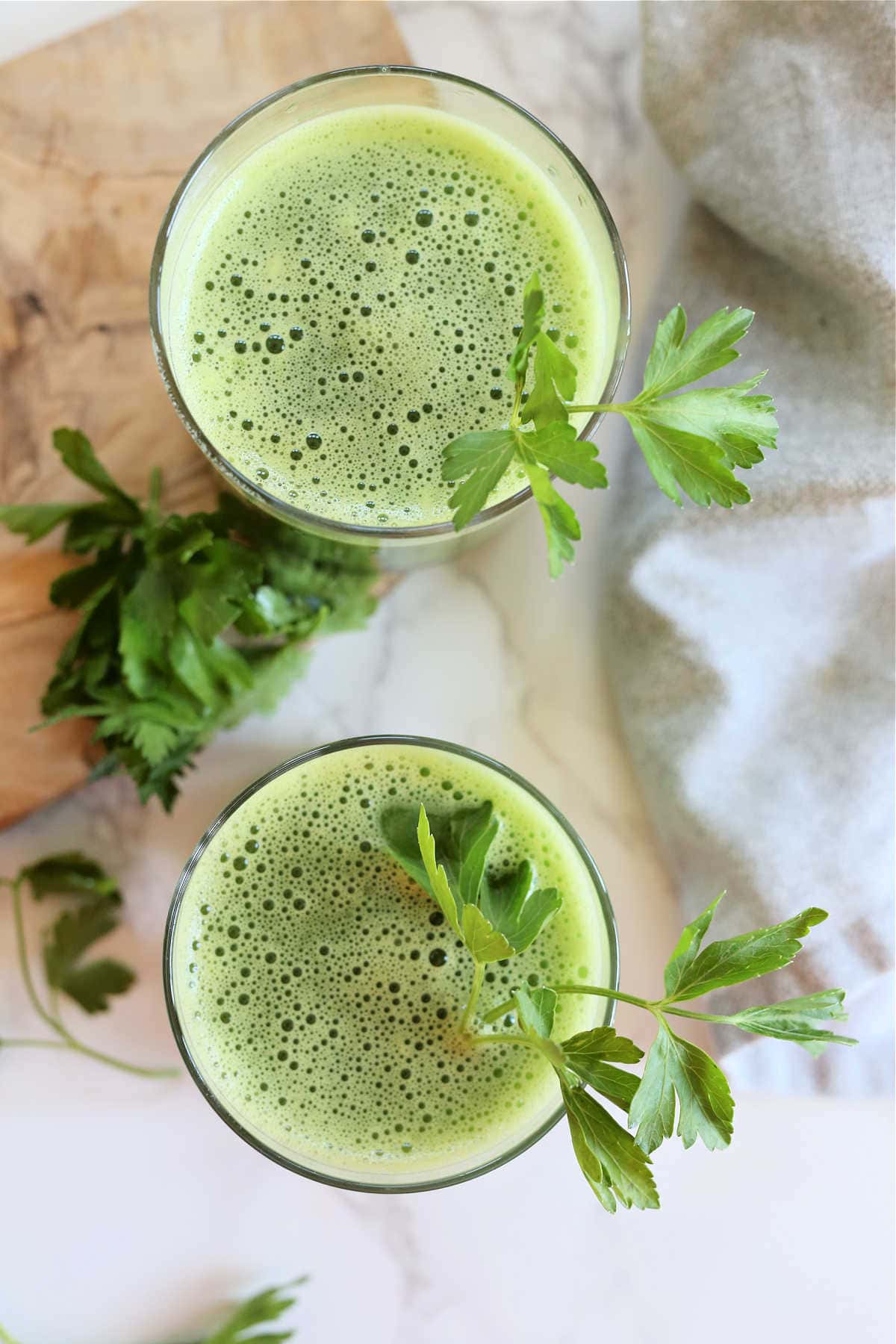 Fresh parsley in green vegetable juice in a glass.