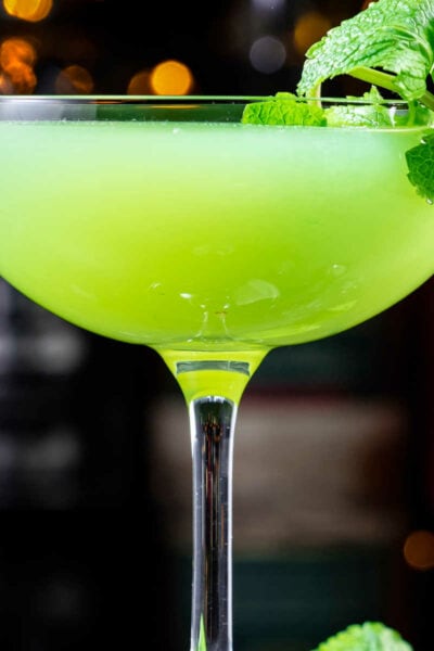 Green cocktails in a glass with fresh mint.
