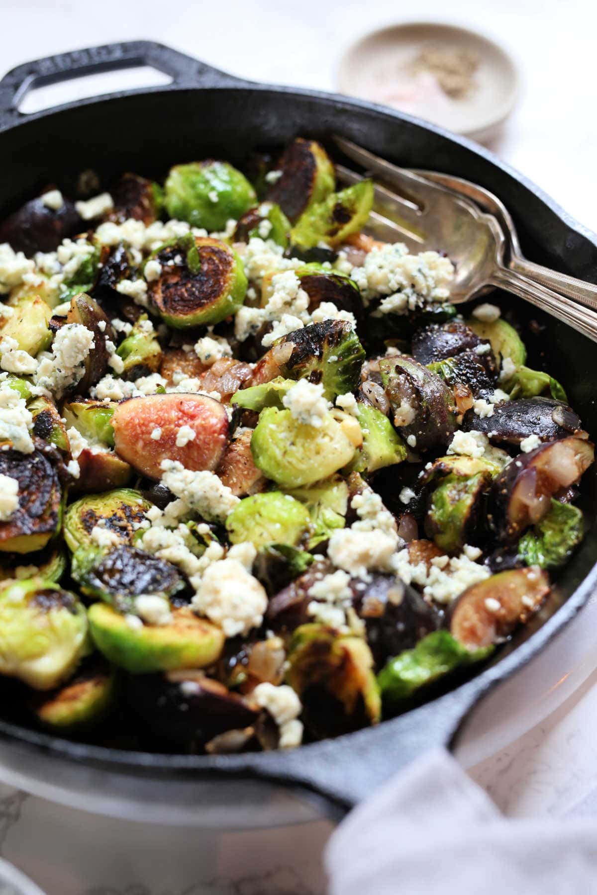 Easy fried brussels sprouts recipe in a cast iron skillet.