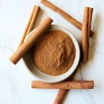 Cinnamon in a bowl with cinnamon sticks and alternatives.