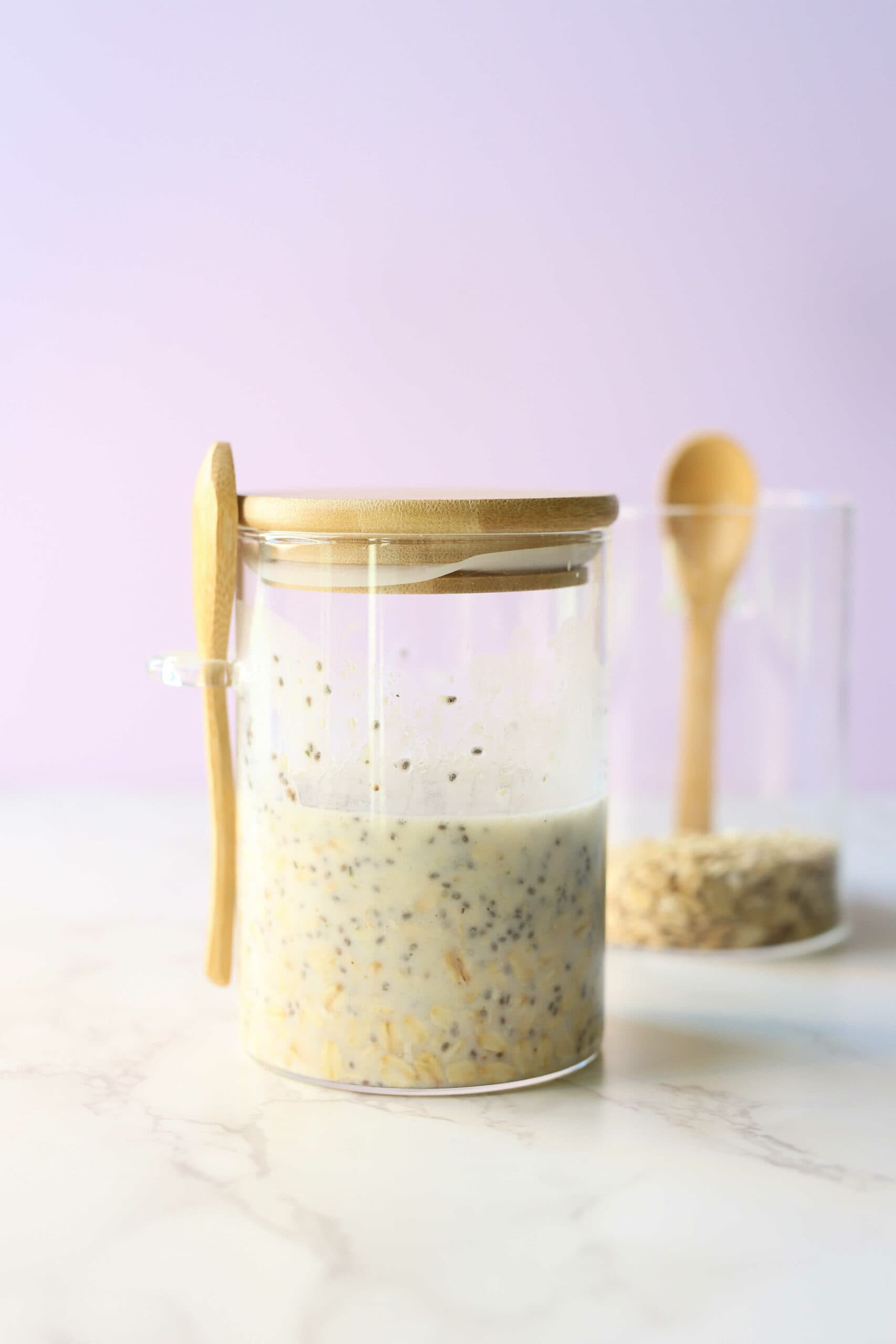 High protein overnight oats in a jars with spoons.