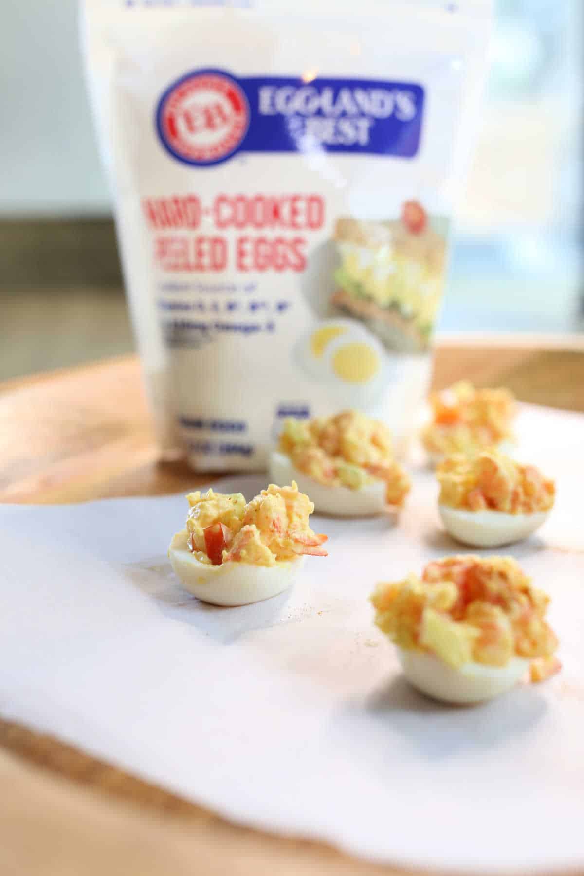 Shrimp deviled eggs on an appetizer tray.