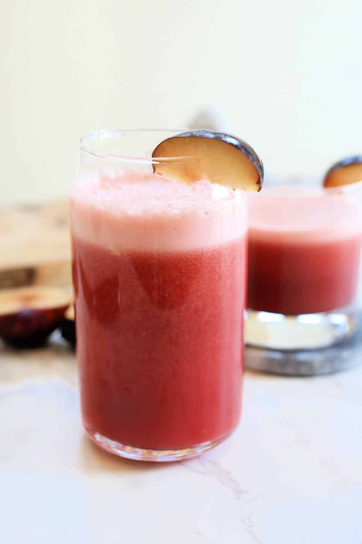 Glass of fresh plum juice.