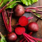 Vegetables that start with b like these sliced beet root vegetables on a table.