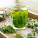 Vegetables that start with n like nettle in cup of tea.