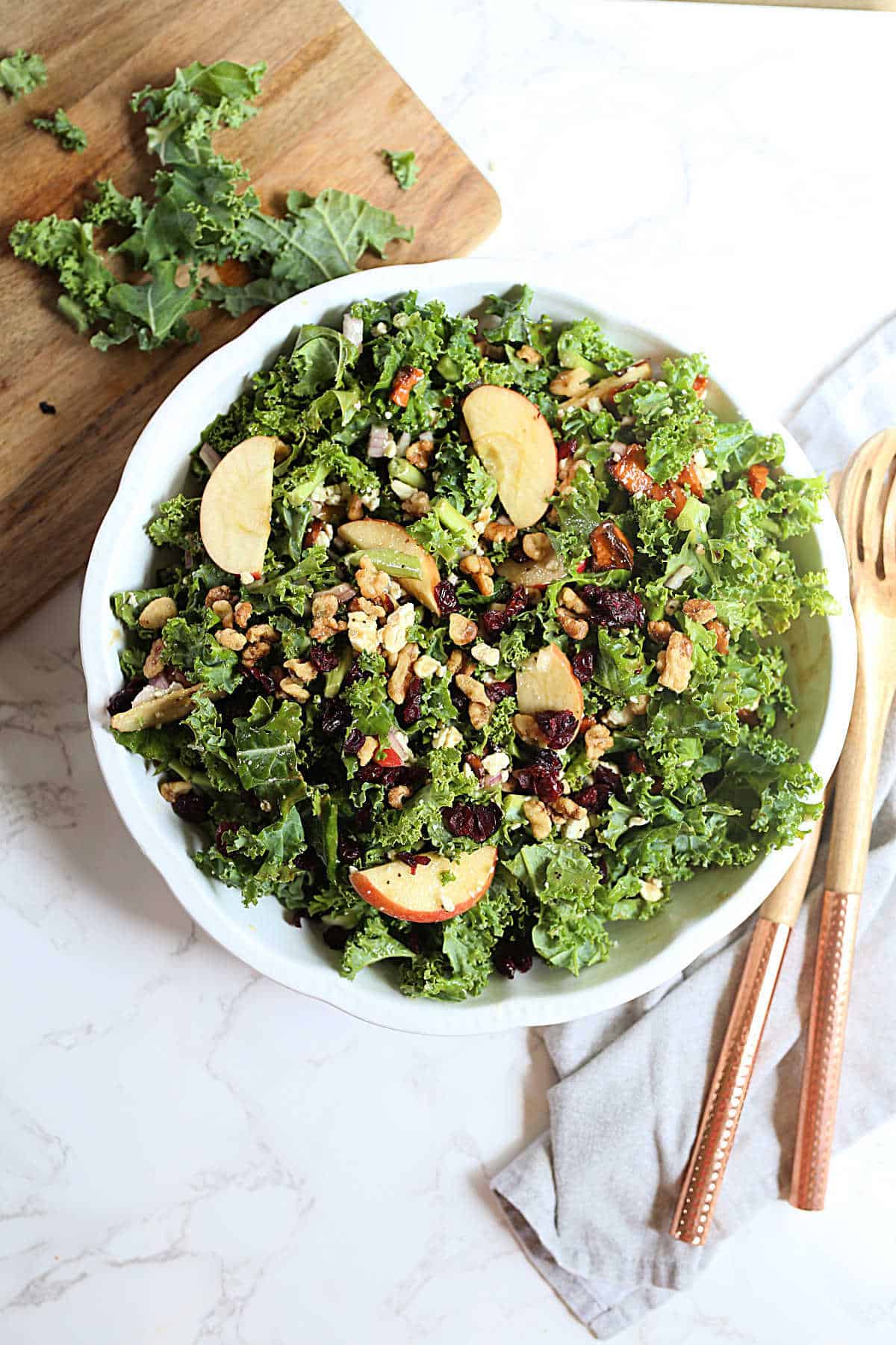 Apple and blue cheese kale salad with walnuts and honey mustard dressing.
