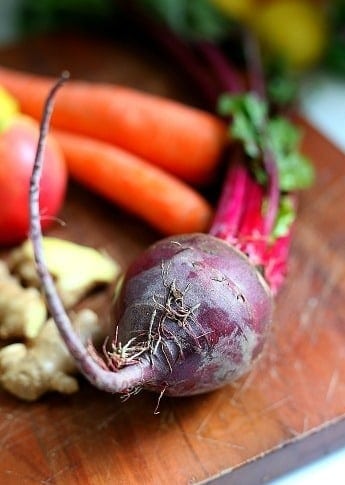 Fresh beets, carrots, apple and ginger prepped for beet juice.
