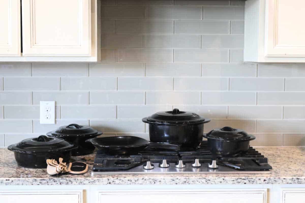 Set of pans made of pure ceramic on a counter in the kitchen.